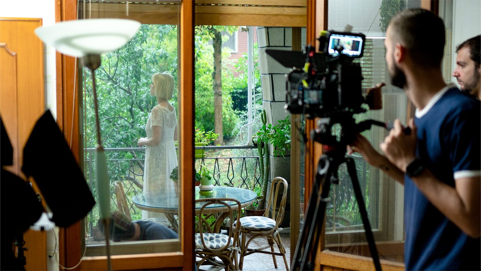 a man taking a picture of a woman in a white dress
